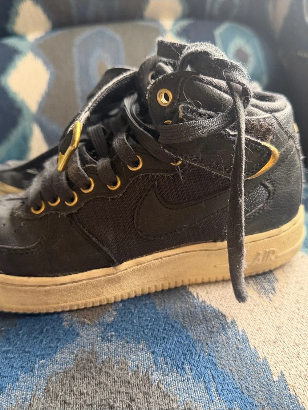 Nike Kids Black Sneakers with Gold Eyelets